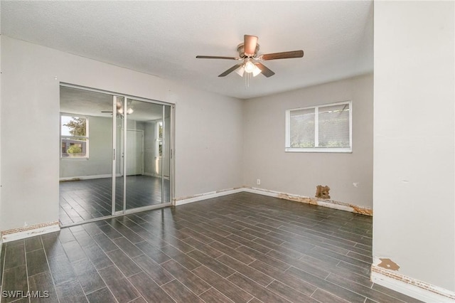 2414 Parkview Dr, Fort Myers, FL 33905 - unfurnished bedroom with baseboards, wood finished floors, a closet, and ceiling fan