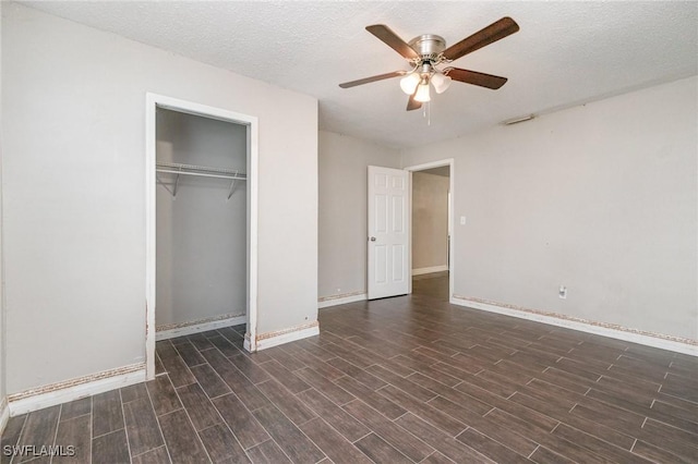 2414 Parkview Dr, Fort Myers, FL 33905 - unfurnished bedroom with wood finished floors, baseboards, a closet, and a textured ceiling