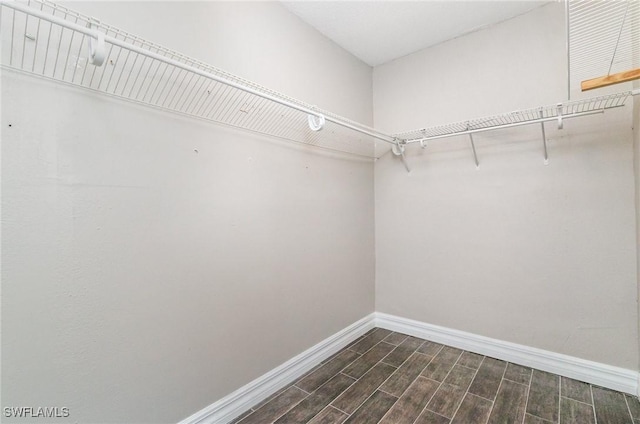 2414 Parkview Dr, Fort Myers, FL 33905 - spacious closet with dark wood-style flooring
