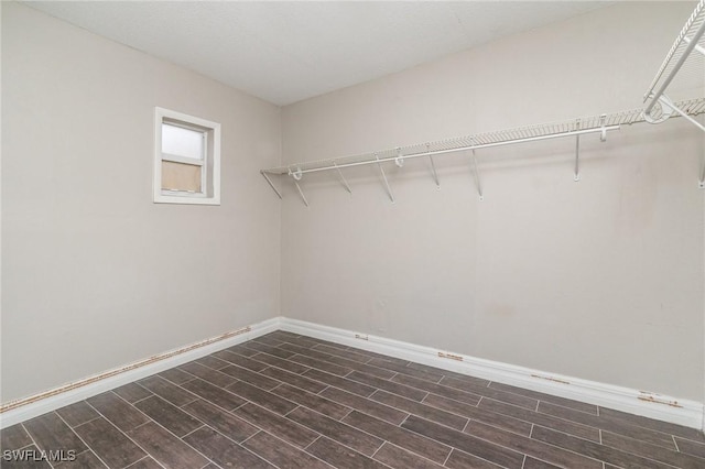 2414 Parkview Dr, Fort Myers, FL 33905 - walk in closet with dark wood finished floors