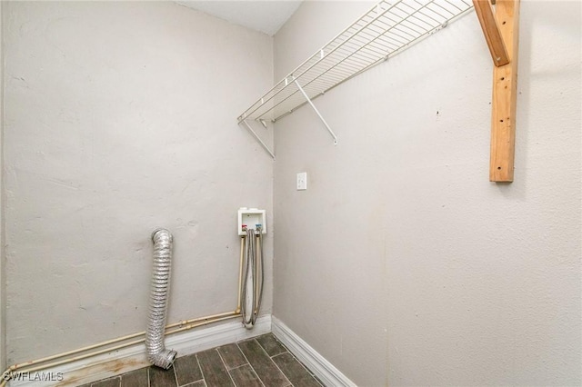 2414 Parkview Dr, Fort Myers, FL 33905 - washroom with washer hookup, wood finished floors, and baseboards
