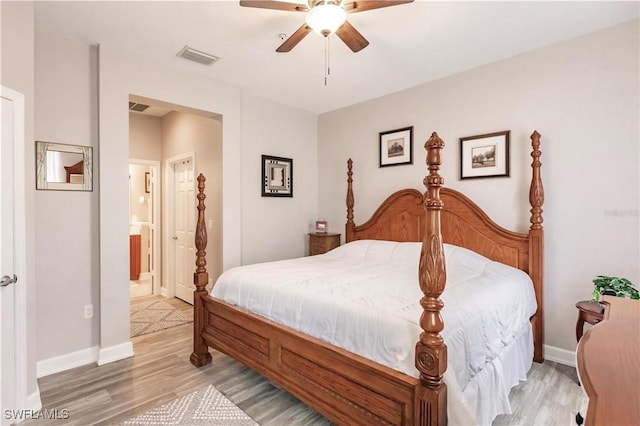 17084 Acapulco Rd Unit 222, Punta Gorda, FL 33955 - bedroom with light wood-type flooring, baseboards, a ceiling fan, and connected bathroom