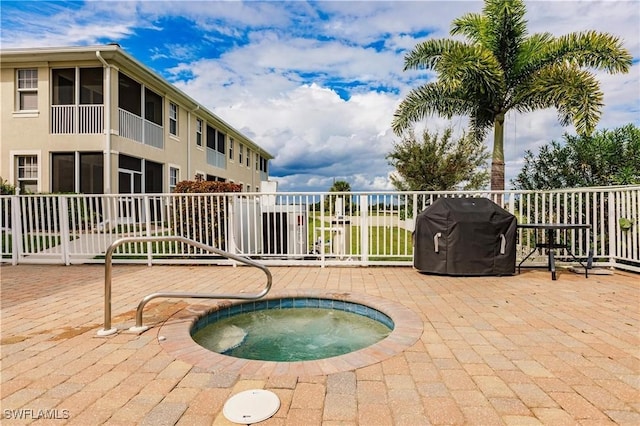17084 Acapulco Rd Unit 222, Punta Gorda, FL 33955 - view of pool featuring a grill, a community hot tub, fence, and a patio area