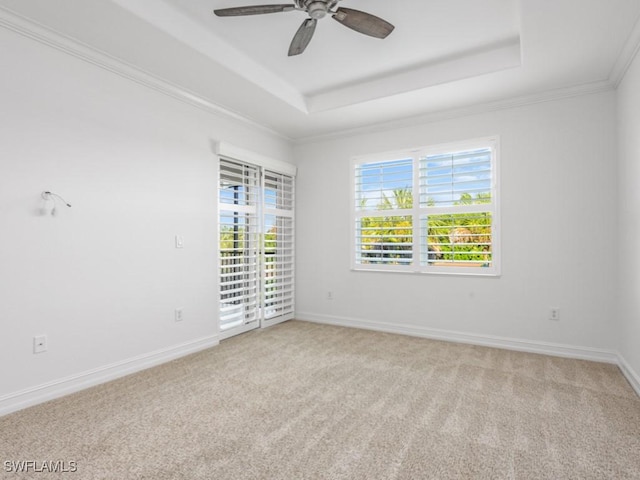 1264 Rialto Way Unit 201, Naples, FL 34114 - empty room featuring a ceiling fan, baseboards, crown molding, a raised ceiling, and light colored carpet