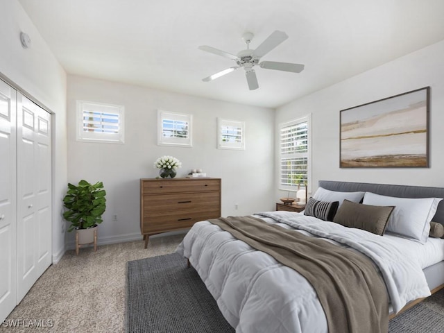 1264 Rialto Way Unit 201, Naples, FL 34114 - bedroom featuring carpet, baseboards, a ceiling fan, and a closet
