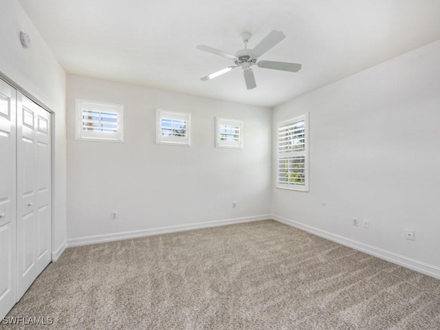 1264 Rialto Way Unit 201, Naples, FL 34114 - carpeted spare room with baseboards and a ceiling fan
