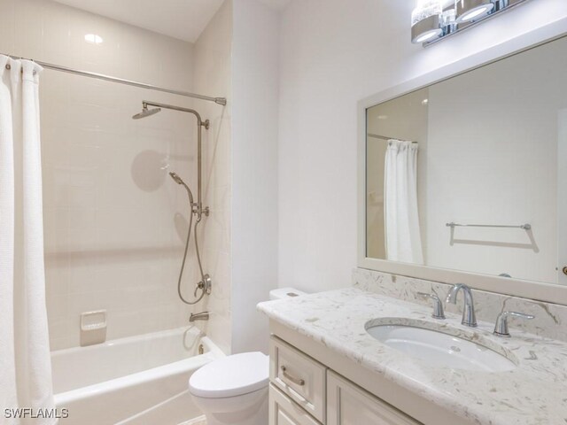 1264 Rialto Way Unit 201, Naples, FL 34114 - bathroom with vanity, shower / bathtub combination with curtain, and toilet