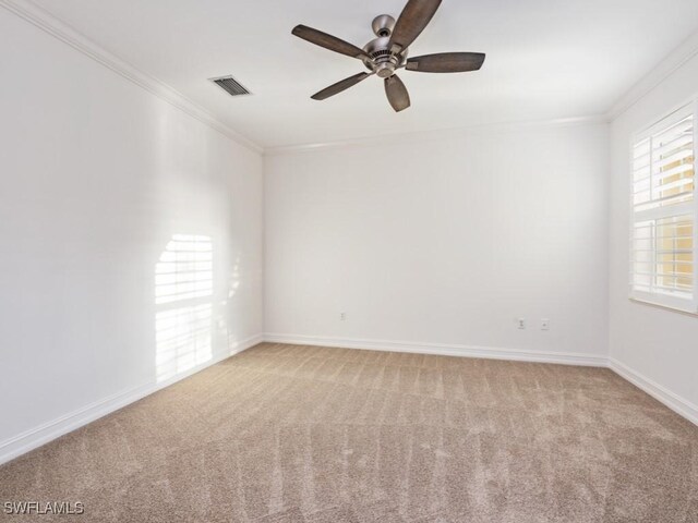 1264 Rialto Way Unit 201, Naples, FL 34114 - spare room with crown molding, visible vents, baseboards, ceiling fan, and light carpet