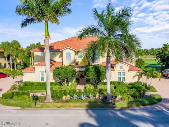 1264 Rialto Way Unit 201, Naples, FL 34114 - mediterranean / spanish house featuring stucco siding