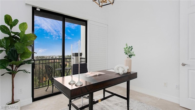 10733 Mirasol Dr Unit 607, Miromar Lakes, FL 33913 - office area with light colored carpet, an inviting chandelier, and baseboards