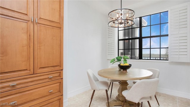 10733 Mirasol Dr Unit 607, Miromar Lakes, FL 33913 - dining room featuring baseboards, a notable chandelier, and light tile patterned flooring