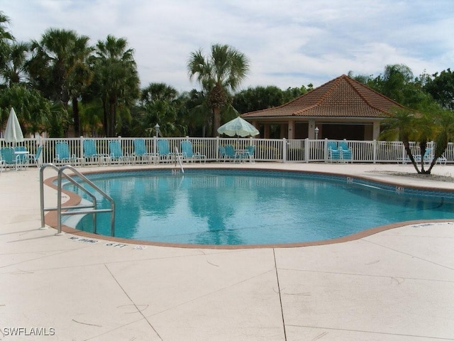 388 Belina Dr Unit 6, Naples, FL 34104 - pool with fence and a patio
