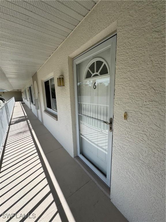 388 Belina Dr Unit 6, Naples, FL 34104 - entrance to property featuring stucco siding