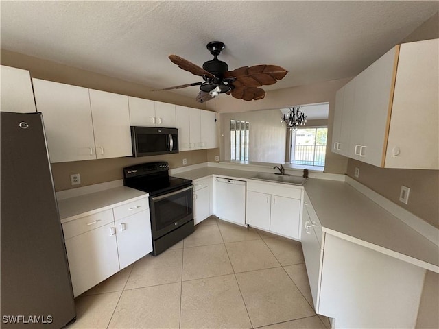 388 Belina Dr Unit 6, Naples, FL 34104 - kitchen featuring black electric range oven, a sink, freestanding refrigerator, light tile patterned flooring, and dishwasher
