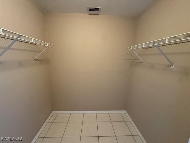 388 Belina Dr Unit 6, Naples, FL 34104 - spacious closet featuring visible vents and tile patterned flooring