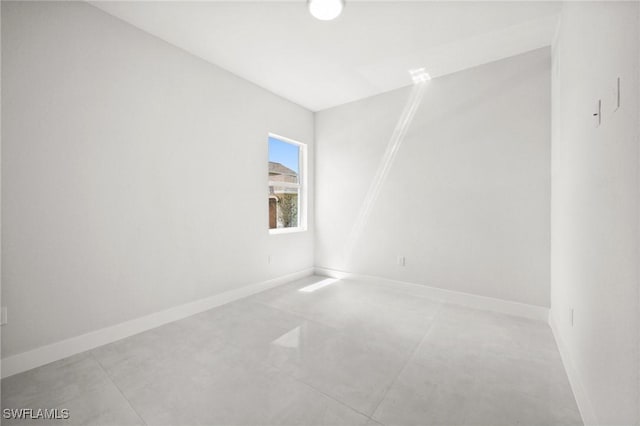 3631 68th Ave NE, Naples, FL 34120 - unfurnished room featuring concrete floors and baseboards