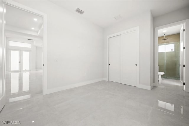 3631 68th Ave NE, Naples, FL 34120 - unfurnished bedroom with connected bathroom, a closet, visible vents, baseboards, and recessed lighting