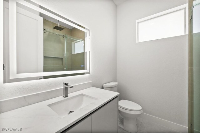3631 68th Ave NE, Naples, FL 34120 - bathroom with a stall shower, vanity, and toilet