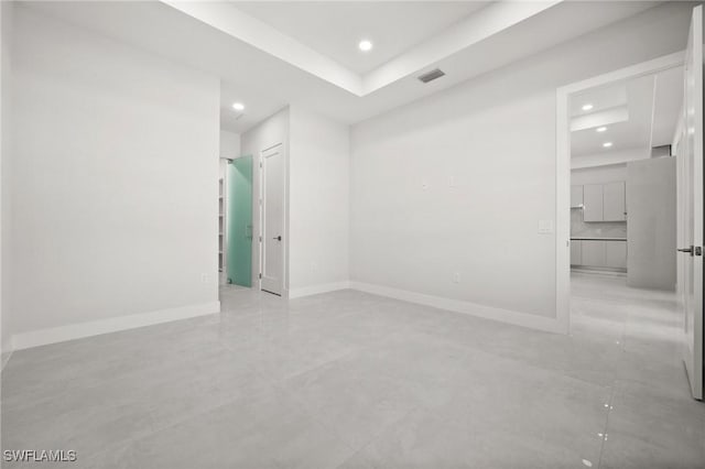 3631 68th Ave NE, Naples, FL 34120 - spare room with a raised ceiling, baseboards, visible vents, and recessed lighting