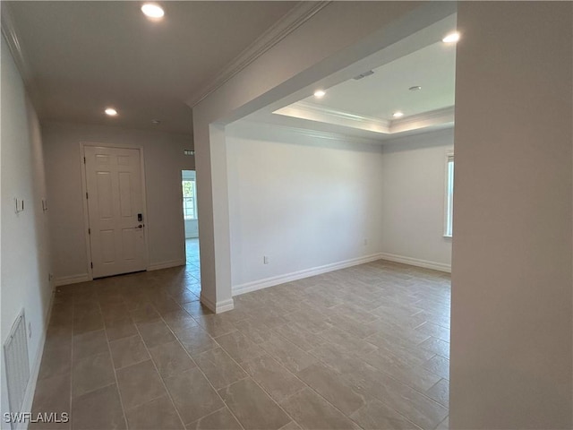 tiled spare room with visible vents, baseboards, ornamental molding, and recessed lighting
