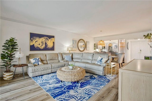 living room with wood finished floors and baseboards