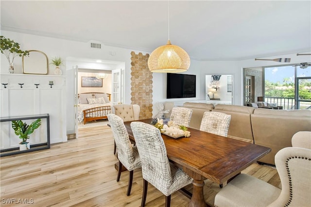 dining space featuring light wood finished floors