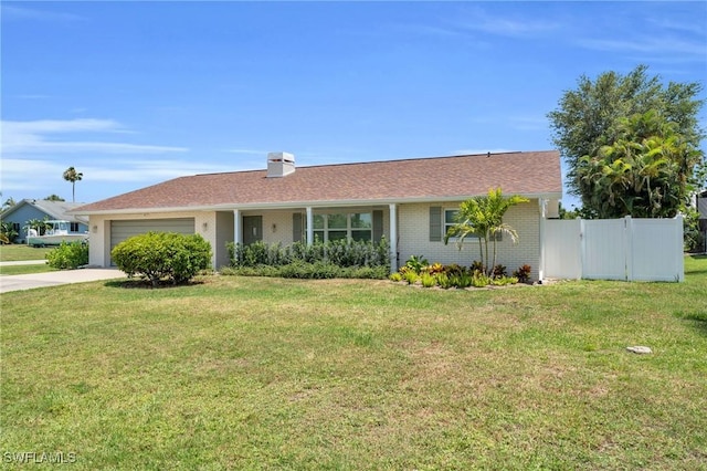 ranch-style house featuring a garage, a chimney, fence, a front lawn, and driveway