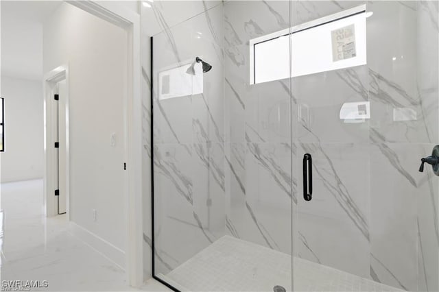 full bathroom with a marble finish shower, baseboards, and marble finish floor