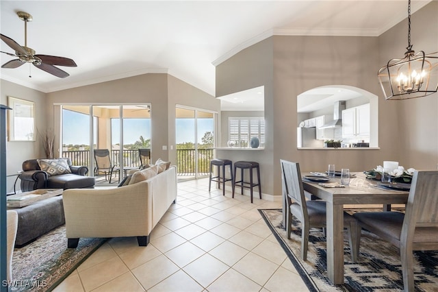 20930 Island Sound Cir Unit 402, Estero, FL 33928 - living area with a chandelier, a ceiling fan, light tile patterned floors, vaulted ceiling, and ornamental molding
