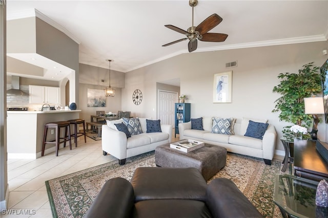 20930 Island Sound Cir Unit 402, Estero, FL 33928 - living area featuring light tile patterned floors, ceiling fan, ornamental molding, and lofted ceiling