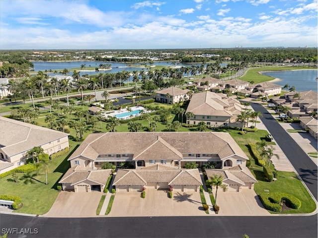 aerial perspective of suburban area with a large body of water