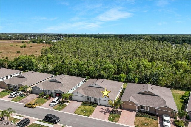 2036 Pigeon Plum Way N, Fort Myers, FL 33917 - birds eye view of property with a view of trees and a residential view
