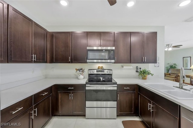 2036 Pigeon Plum Way N, Fort Myers, FL 33917 - kitchen with a sink, ceiling fan, stainless steel appliances, and light countertops