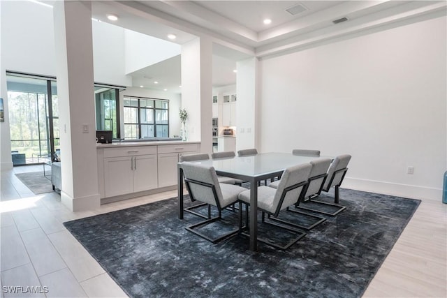 dining room with baseboards, visible vents, and recessed lighting