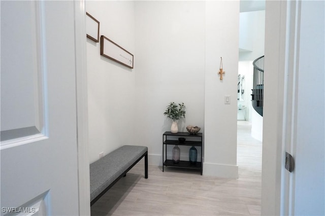 corridor featuring light wood-style floors