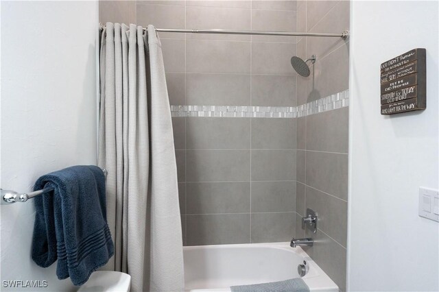 full bathroom with shower / tub combo with curtain