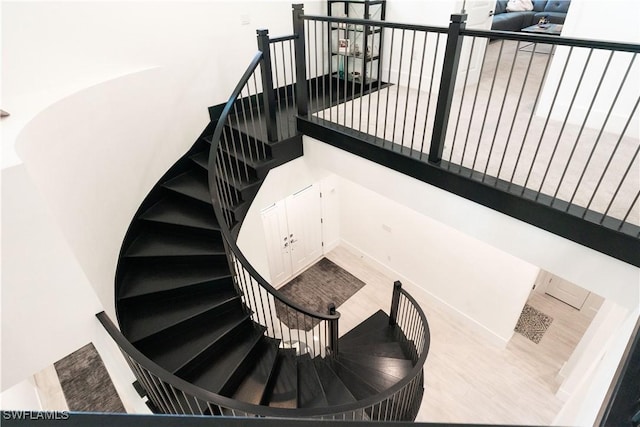 stairway with wood finished floors