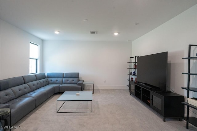 living area with carpet, visible vents, baseboards, and recessed lighting