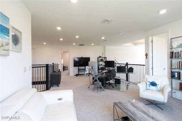 living area featuring light carpet, visible vents, and recessed lighting