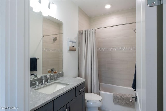 bathroom with vanity, toilet, shower / bath combo with shower curtain, and recessed lighting