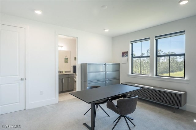 office featuring light colored carpet, baseboards, and recessed lighting