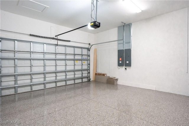 garage with electric panel and a garage door opener