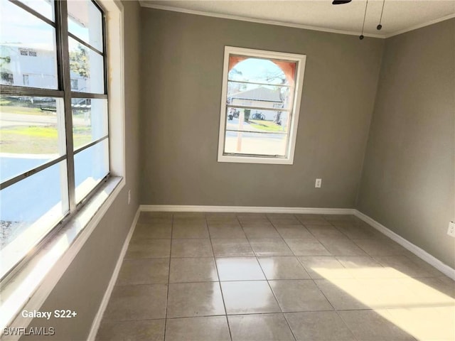 16901 Juanita Ave, Fort Myers, FL 33908 - empty room featuring baseboards, tile patterned flooring, and crown molding