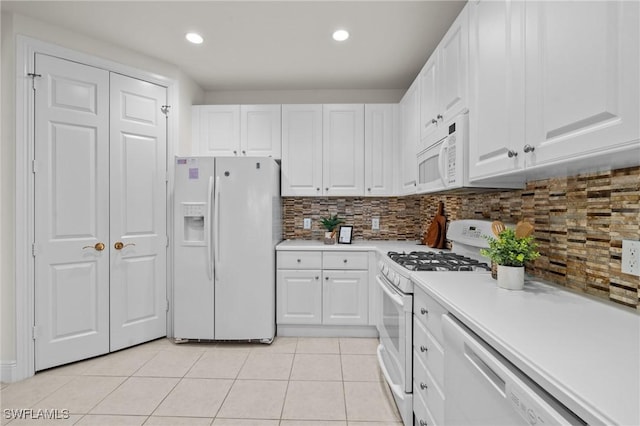 9083 Cascada Way Unit 101, Naples, FL 34114 - kitchen featuring white appliances, white cabinets, light countertops, and recessed lighting