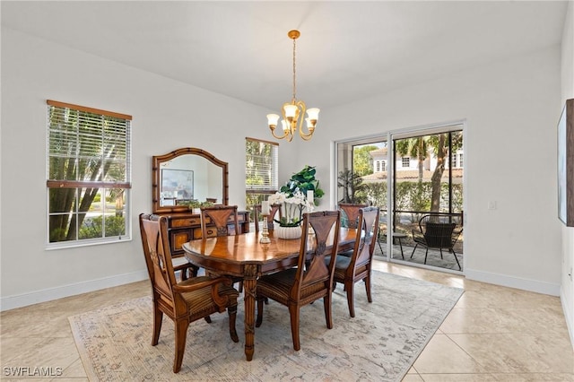 9083 Cascada Way Unit 101, Naples, FL 34114 - dining room featuring a chandelier, healthy amount of natural light, baseboards, and light tile patterned floors