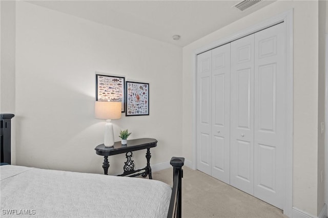 9083 Cascada Way Unit 101, Naples, FL 34114 - carpeted bedroom featuring a closet and baseboards