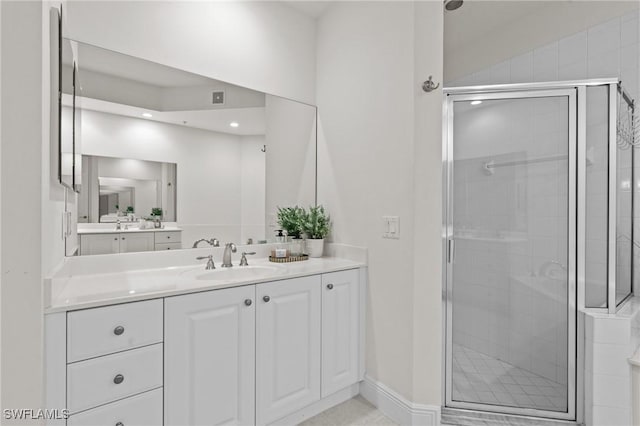 9083 Cascada Way Unit 101, Naples, FL 34114 - full bathroom featuring a stall shower, vanity, recessed lighting, and baseboards