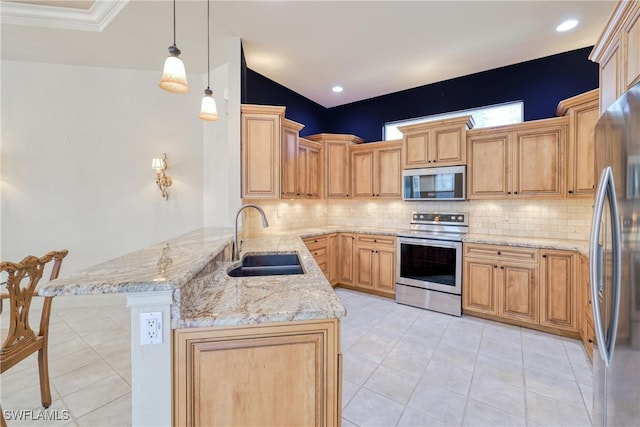 kitchen with a sink, a peninsula, tasteful backsplash, light tile patterned floors, and appliances with stainless steel finishes