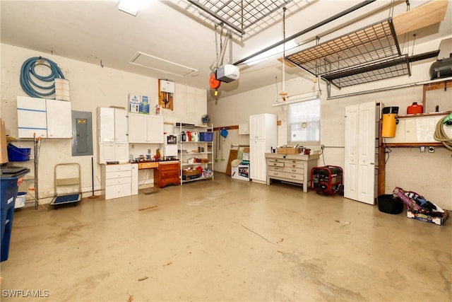 garage with electric panel and a garage door opener