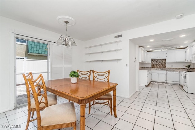 5816 Whiting Ct, Fort Myers, FL 33919 - dining room featuring light tile patterned flooring, a chandelier, recessed lighting, a ceiling fan, and baseboards